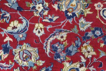 Vibrant red traditional rug with intricate blue and cream floral patterns homelooks.com