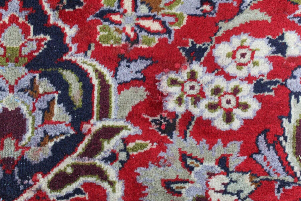 Opulent red and navy antique carpet for classic home styling design details homelooks.com