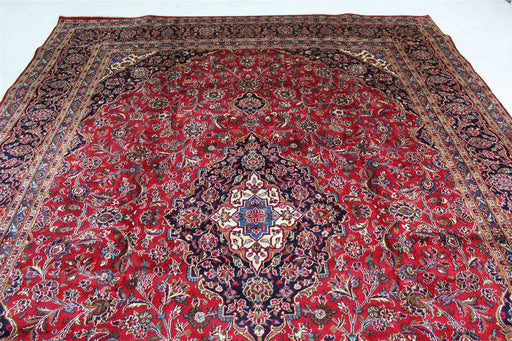 Expansive traditional Persian rug laid out, showcasing detailed medallion and border patterns. www.homelooks.com