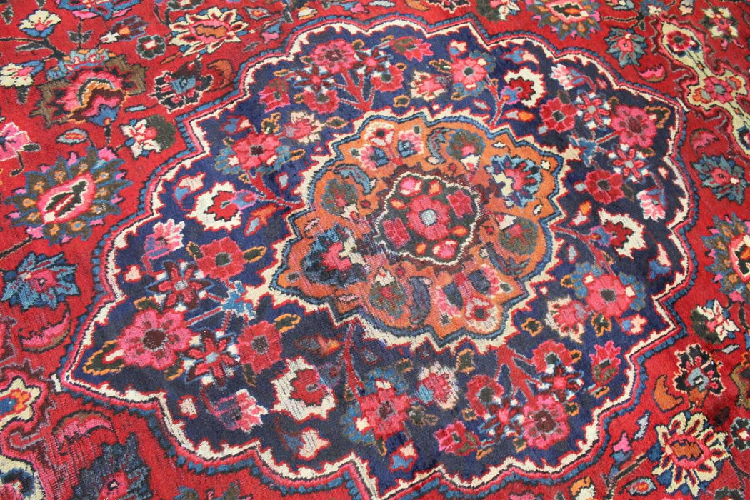 Vintage-style handmade wool rug with central medallion design homelooks.com