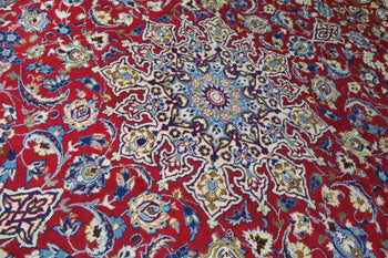 Richly patterned red oriental rug with a central floral medallion and ornate border homelooks.com