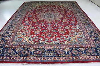 Full view of a Antique Area Carpets Wool Handmade Oriental Rug with a deep red central area surrounded by complex borders featuring floral patterns and a wide variety of colors including blues, reds, and creams. homelooks.com