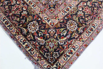 Corner section of a Persian rug highlighting the precision of its border patterns and the richness of its red and blue dyes. homelooks.com