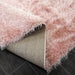 Lily Shimmer Blush Pink Shaggy Rug folded www.homelooks.com