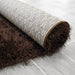 Lily Shimmer Brown Shaggy Rug rolled up www.homelooks.com
