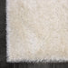 Lily Shimmer Cream Shaggy Rug corner view www.homelooks.com