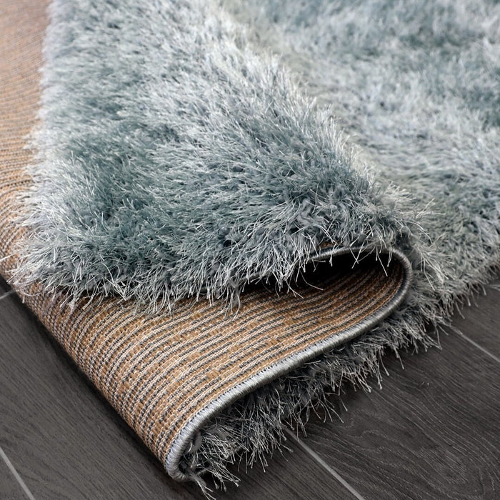 Lily Shimmer Duck Egg Shaggy Rug folded www.homelooks.com
