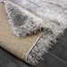 Lily Shimmer Grey Shaggy Rug folded www.homelooks.com