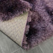 Lily Shimmer Purple Shaggy Rug folded www.homelooks.com