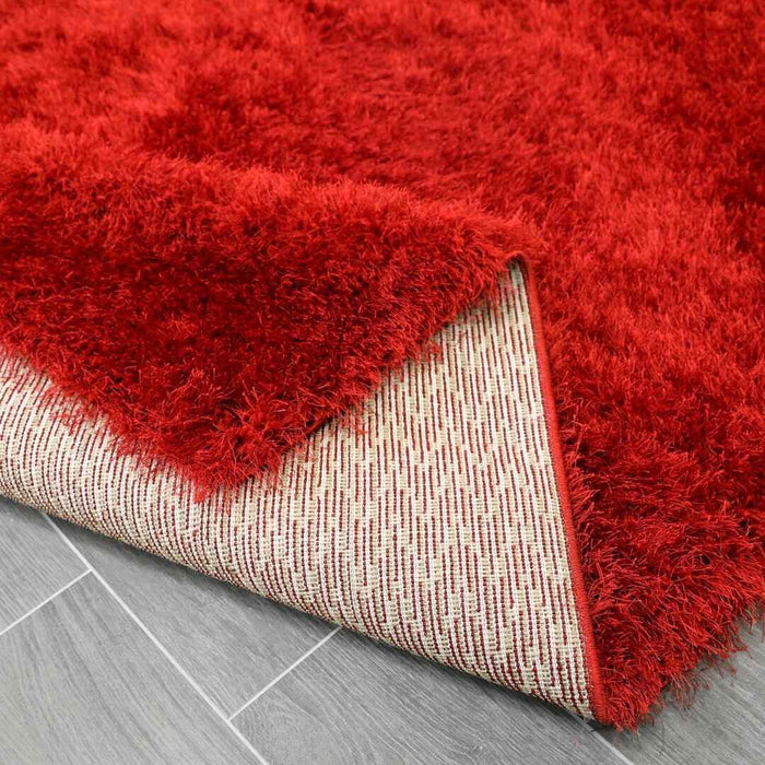 Lily Shimmer Red Shaggy Rug folded www.homelooks.com
