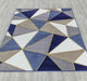 Ritz Pyramid Triangular Rug Gold & Navy on wooden floor homelooks.com