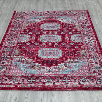 Amsterdam Medallion Rug laid out on grey wooden flooring, highlighting its full design and rich colors. - Red 7 - www.homelooks.com