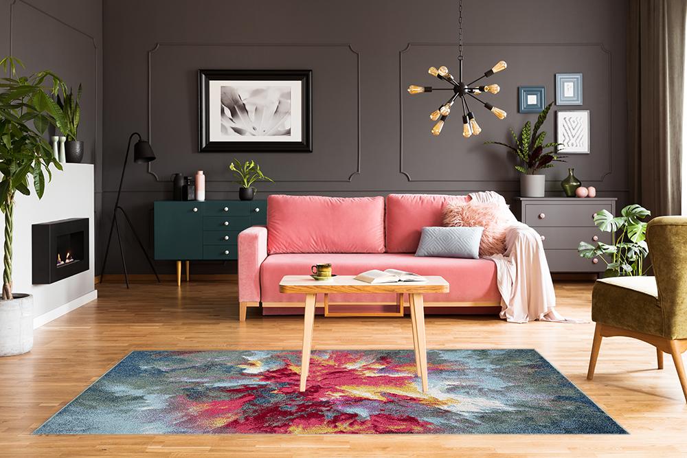 Elegant living room with grey walls featuring the Amsterdam Paradise rug as a colorful centerpiece www.homelooks.com