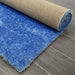 Puffy Shimmer Blue Shaggy Rug folded www.homelooks.com