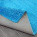 Puffy Shimmer Turquoise Shaggy Rug folded corner www.homelooks.com