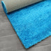 Puffy Shimmer Turquoise Shaggy Rug folded www.homelooks.com 